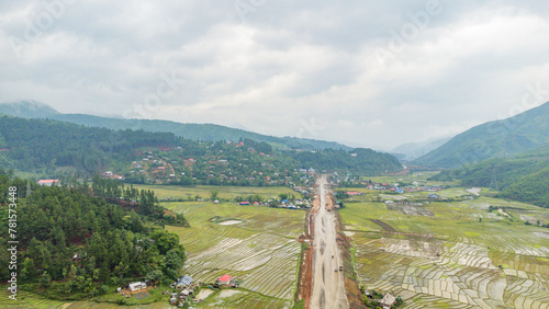 Rice field aerial shot at north east of India. Aerial views of beautiful mountain small house and rice terraces field at kangpokpi village rice terraces with senapati river manipur india. photo