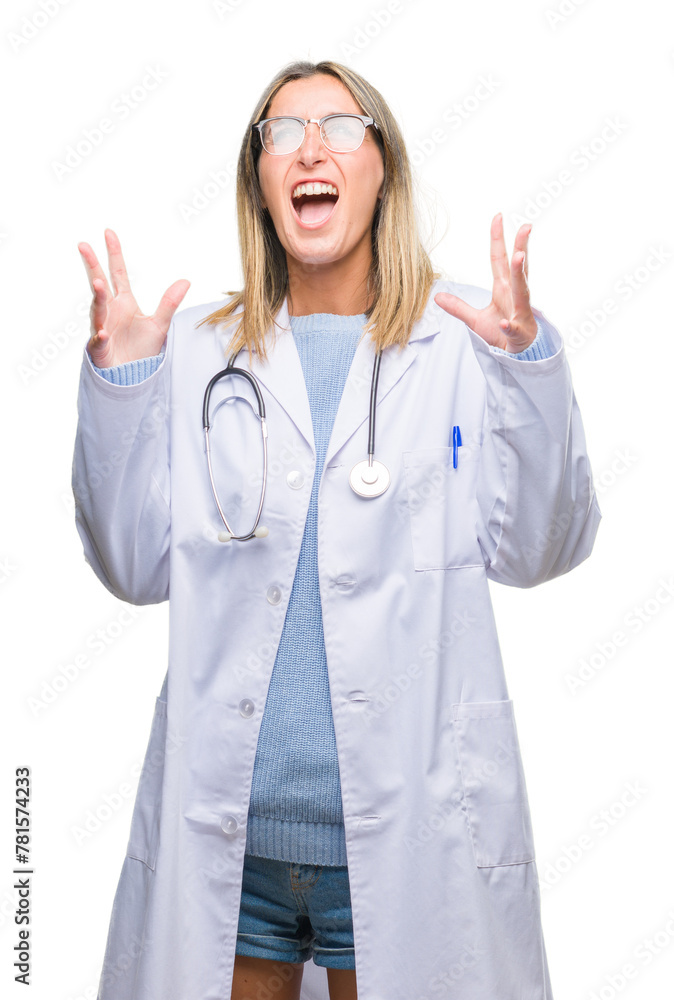 Young beautiful doctor woman headphones over isolated background crazy and mad shouting and yelling with aggressive expression and arms raised. Frustration concept. Young beautiful doctor woman headphones over isolated background crazy and mad shouting and yelling with aggressive expression and arms raised. Frustration concept.
