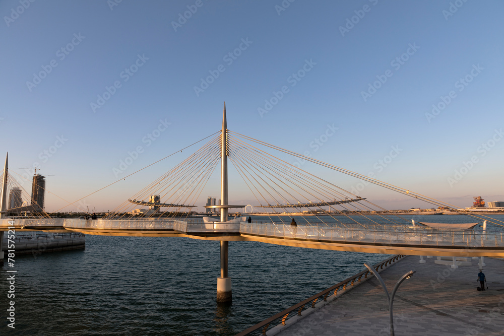 Obraz premium Qetaifan Island Suspension Park, which allows visitors to see the sea water from below and see the Boulevard Towers from there, Qatar, Lusail
