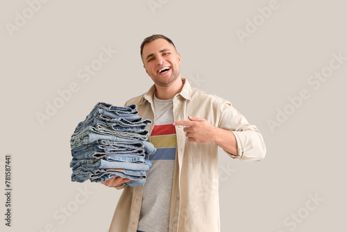 Young man pointing at stack...