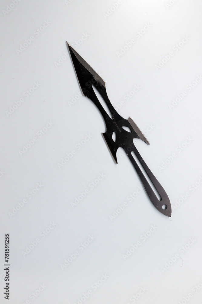 Black knife on white background. isolated, selective focus. Black knife on white background. isolated, selective focus.