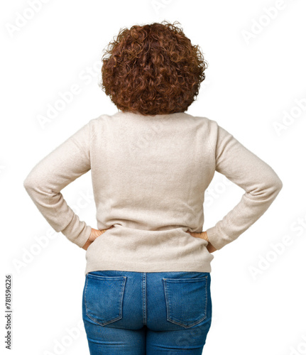 Beautiful middle ager senior woman wearing turtleneck sweater and glasses over isolated background standing backwards looking away with arms on body photo