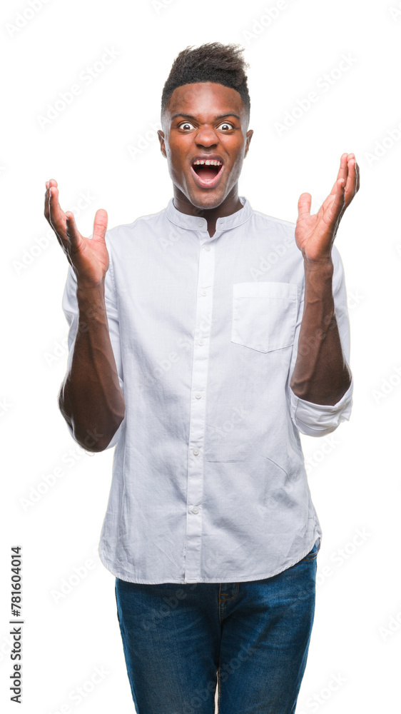 Fototapeta premium Young african american man over isolated background crazy and mad shouting and yelling with aggressive expression and arms raised. Frustration concept.