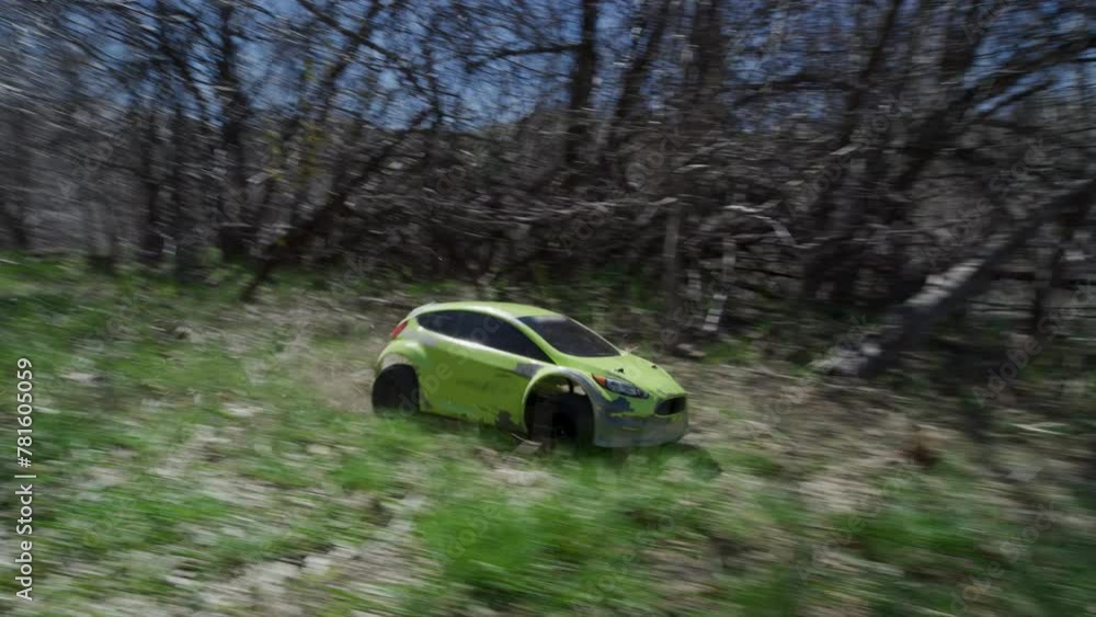 Little green rc car skidding in grass - slow motion Little green rc car skidding in grass - slow motion