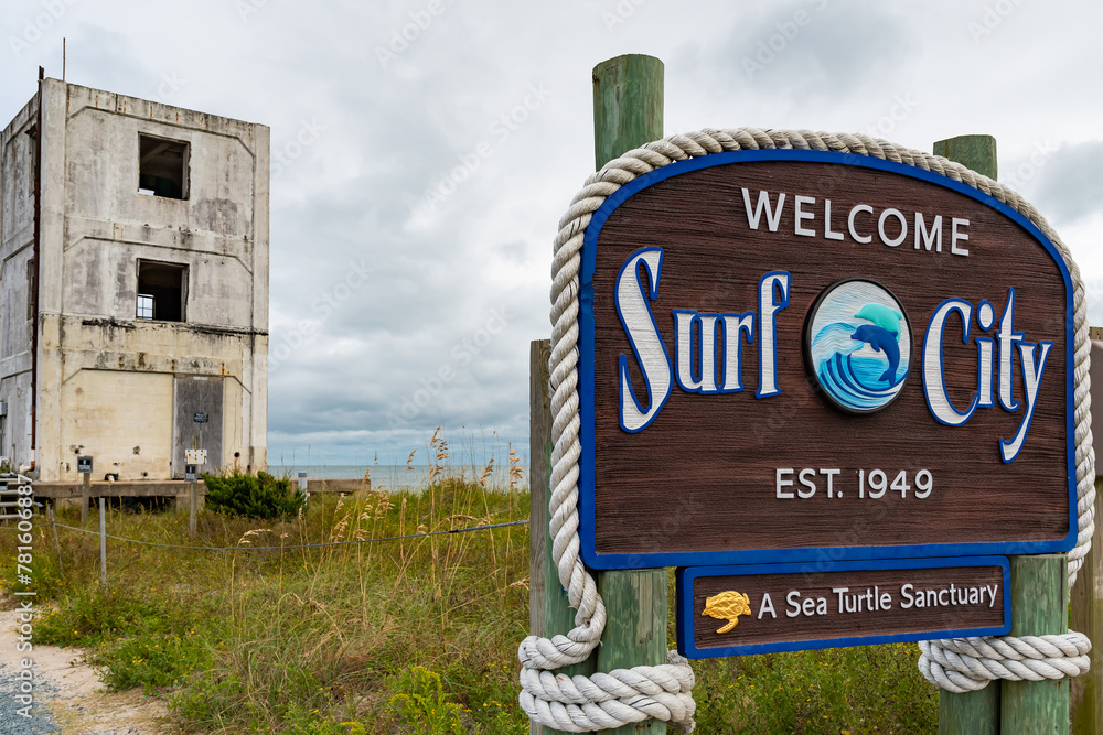 Surf City sign with building