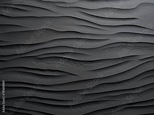 Abstract background formed by a black wall of sand and concrete