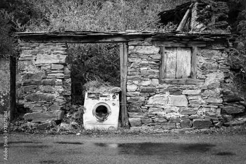 Old Washing Machine in the ruins of an old rustic house - Las Herrerias, Vega de Valcarce, El Bierzo, province of Leon, Castille and Leon, Spain photo
