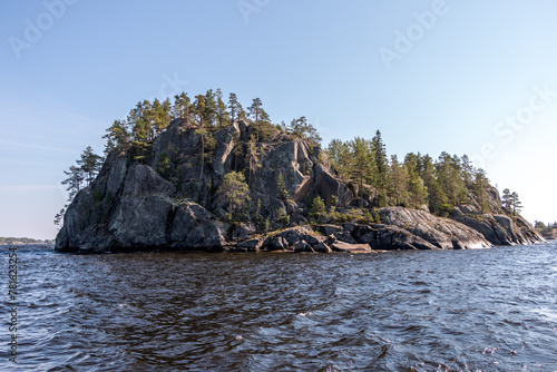 Lake Ladoga and rocky islands. Karelian forest, trees growing on rocks. Ladoga skerries. Nordic Scandinavian landscape photo