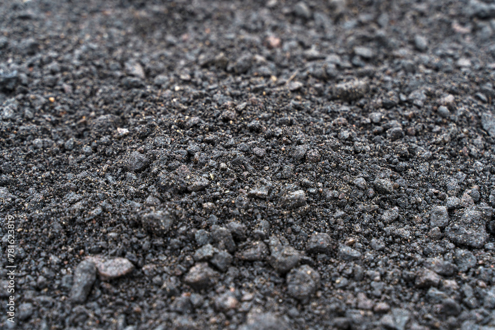 Black soil texture background. Black land surface. Farm agriculture field. Black soil texture background. Black land surface. Farm agriculture field.