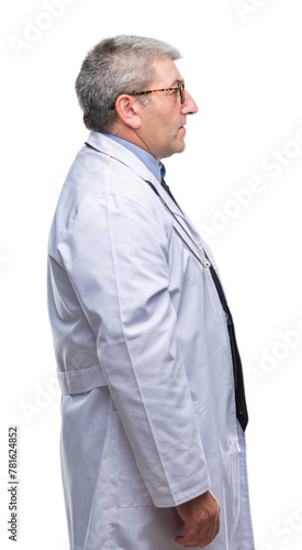 Handsome senior doctor man over isolated background looking to side  relax profile pose with natural face with confident smile.