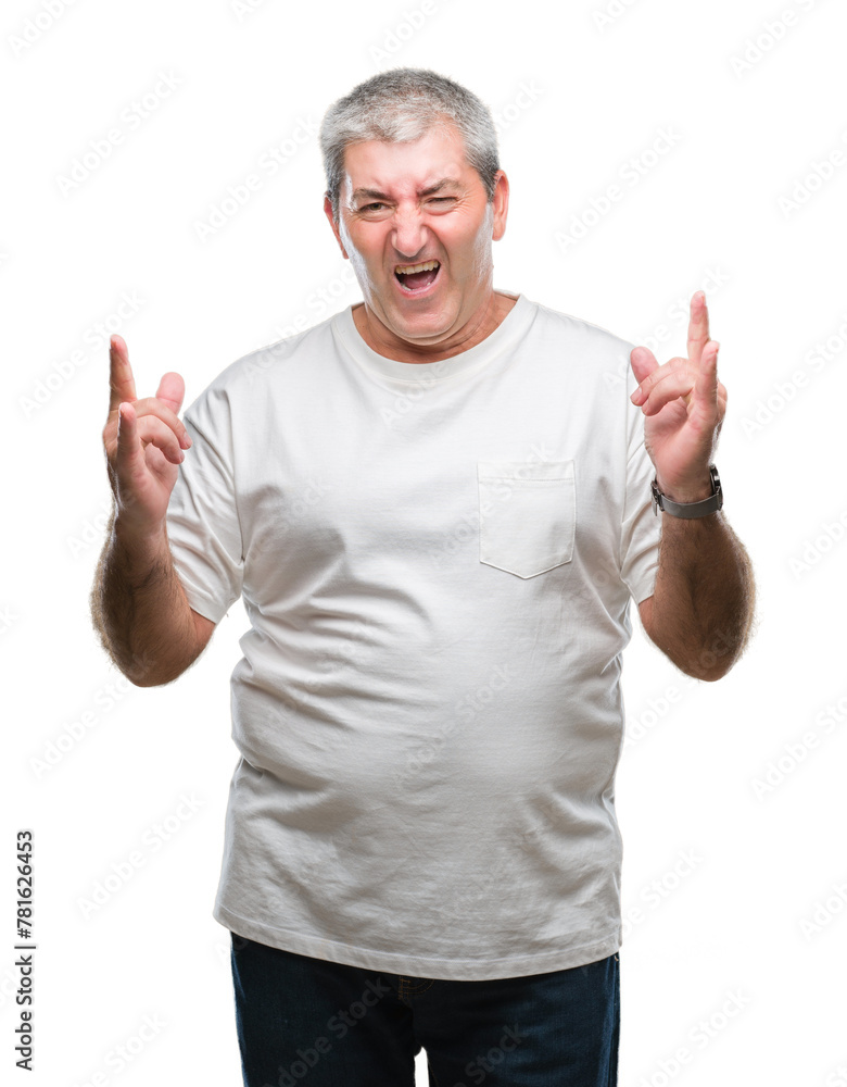 Handsome senior man over isolated background shouting with crazy expression doing rock symbol with hands up. Music star. Heavy concept. Handsome senior man over isolated background shouting with crazy expression doing rock symbol with hands up. Music star. Heavy concept.