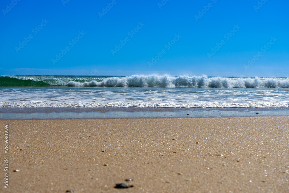 View of idyllic nature landscape with huge beaches and waves crashing on. Manta Rota beach. West Atlantic coast of Algarve region, south of Portugal. View of idyllic nature landscape with huge beaches and waves crashing on. Manta Rota beach. West Atlantic coast of Algarve region, south of Portugal.