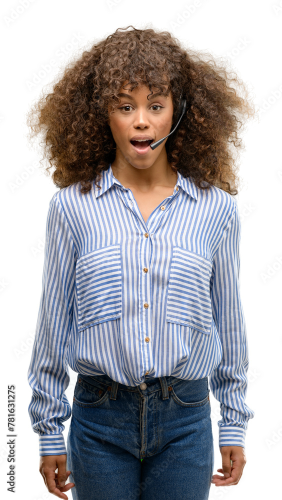 African american call center operator woman scared in shock with a surprise face, afraid and excited with fear expression African american call center operator woman scared in shock with a surprise face, afraid and excited with fear expression