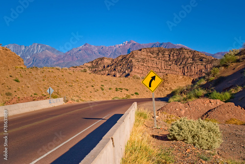 Road bend across the desert by the Andes Mountains in Mendoza, Argentina.