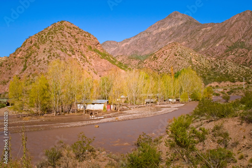 Abandoned cabins by the river near Lake Potrerillos, in Mendoza, Argentina.