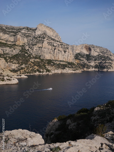 French Calanques in the village of Sormiou, with view of a sailing boat