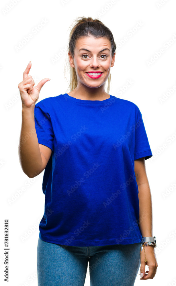 Young beautiful woman wearing casual blue t-shirt over isolated background smiling and confident gesturing with hand doing size sign with fingers while looking and the camera. Measure concept. Young beautiful woman wearing casual blue t-shirt over isolated background smiling and confident gesturing with hand doing size sign with fingers while looking and the camera. Measure concept.