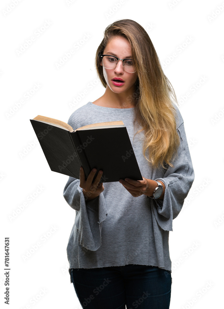 Young beautiful blonde woman reading a book over isolated background scared in shock with a surprise face, afraid and excited with fear expression Young beautiful blonde woman reading a book over isolated background scared in shock with a surprise face, afraid and excited with fear expression