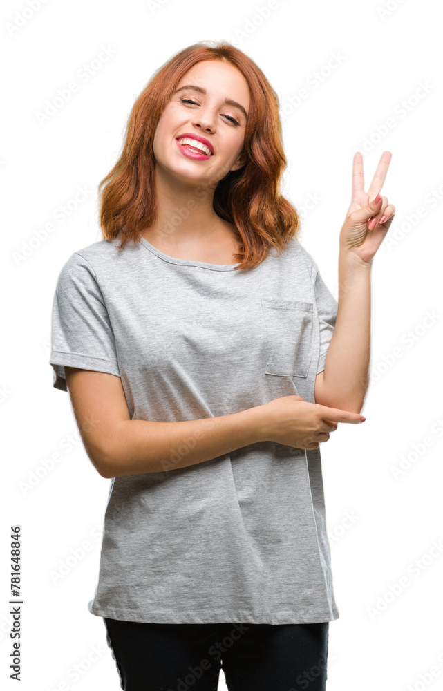 Young beautiful woman over isolated background smiling with happy face winking at the camera doing victory sign. Number two. Young beautiful woman over isolated background smiling with happy face winking at the camera doing victory sign. Number two.