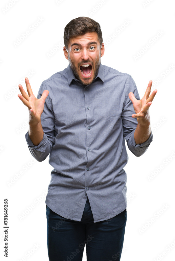 Young handsome man over isolated background celebrating crazy and amazed for success with arms raised and open eyes screaming excited. Winner concept Young handsome man over isolated background celebrating crazy and amazed for success with arms raised and open eyes screaming excited. Winner concept