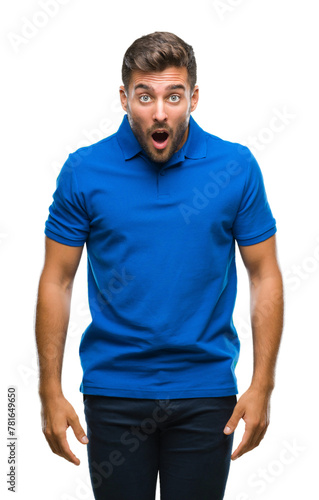 Young handsome man over isolated background afraid and shocked with surprise expression, fear and excited face.