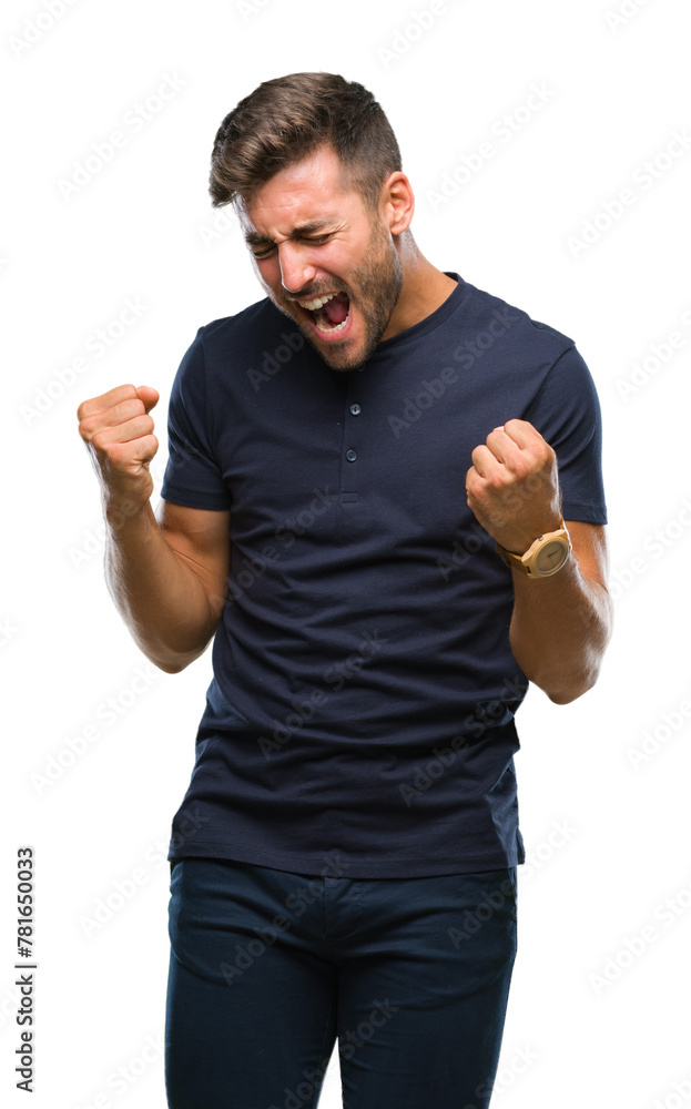 Young handsome man over isolated background very happy and excited doing winner gesture with arms raised, smiling and screaming for success. Celebration concept. Young handsome man over isolated background very happy and excited doing winner gesture with arms raised, smiling and screaming for success. Celebration concept.