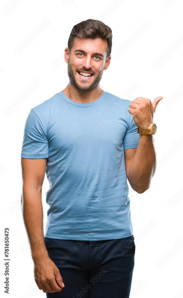 Young handsome man over isolated background smiling with happy face looking and pointing to the side with thumb up. Young handsome man over isolated background smiling with happy face looking and pointing to the side with thumb up.