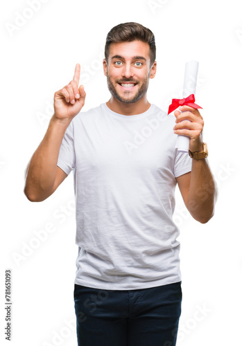 Young handsome man holding degree over isolated background surprised with an idea or question pointing finger with happy face, number one