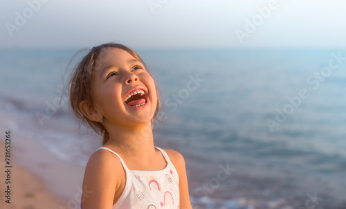 Girl laughing on the seashore