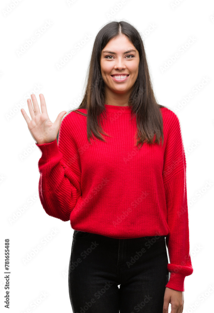 Young beautiful hispanic wearing red sweater showing and pointing up with fingers number five while smiling confident and happy. Young beautiful hispanic wearing red sweater showing and pointing up with fingers number five while smiling confident and happy.
