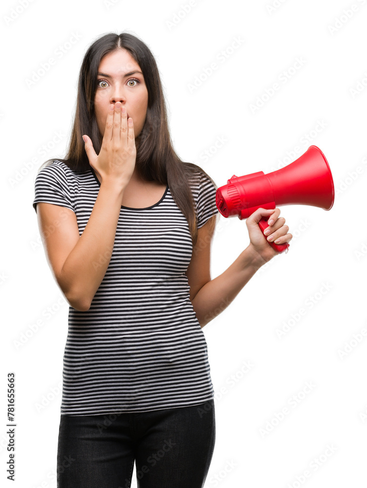 Young hispanic woman holding megaphone cover mouth with hand shocked with shame for mistake, expression of fear, scared in silence, secret concept Young hispanic woman holding megaphone cover mouth with hand shocked with shame for mistake, expression of fear, scared in silence, secret concept