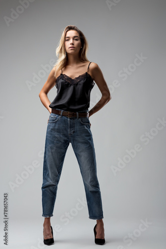 Lace top, denim jeans, elegance stands tall