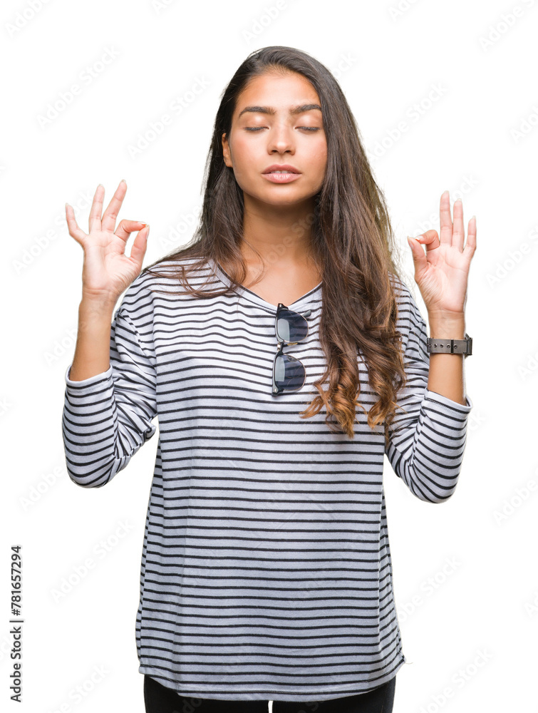 Young beautiful arab woman wearing sunglasses over isolated background relax and smiling with eyes closed doing meditation gesture with fingers. Yoga concept. Young beautiful arab woman wearing sunglasses over isolated background relax and smiling with eyes closed doing meditation gesture with fingers. Yoga concept.