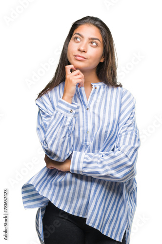 Young beautiful arab woman over isolated background with hand on chin thinking about question, pensive expression. Smiling with thoughtful face. Doubt concept.