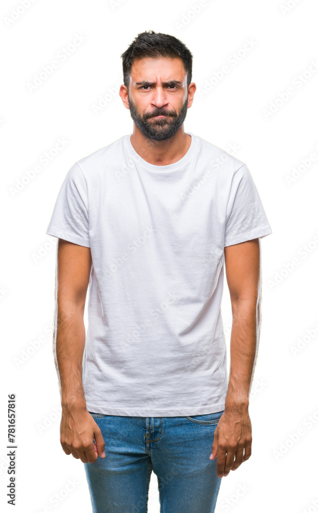 Adult hispanic man over isolated background skeptic and nervous, frowning upset because of problem. Negative person. Adult hispanic man over isolated background skeptic and nervous, frowning upset because of problem. Negative person.
