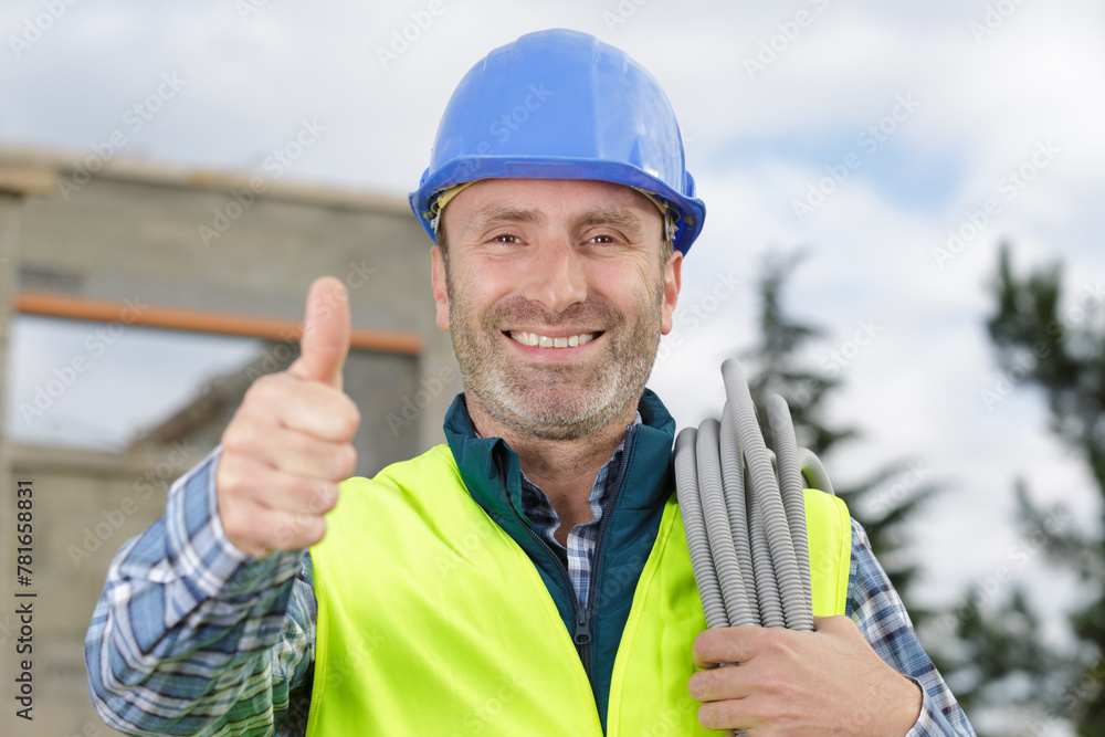 happy male builder showing thumb up - obrazy, fototapety, plakaty 