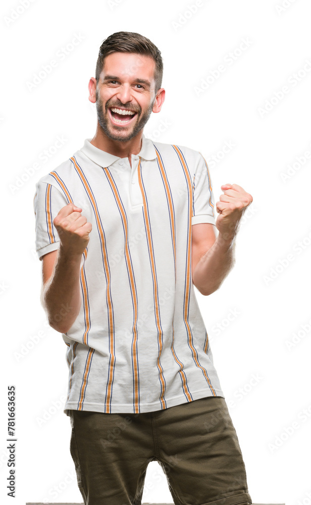 Young handsome man over isolated background very happy and excited doing winner gesture with arms raised, smiling and screaming for success. Celebration concept. Young handsome man over isolated background very happy and excited doing winner gesture with arms raised, smiling and screaming for success. Celebration concept.