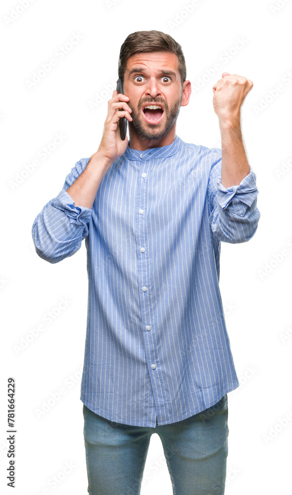 Young handsome man speaking on the phone over isolated background annoyed and frustrated shouting with anger, crazy and yelling with raised hand, anger concept Young handsome man speaking on the phone over isolated background annoyed and frustrated shouting with anger, crazy and yelling with raised hand, anger concept
