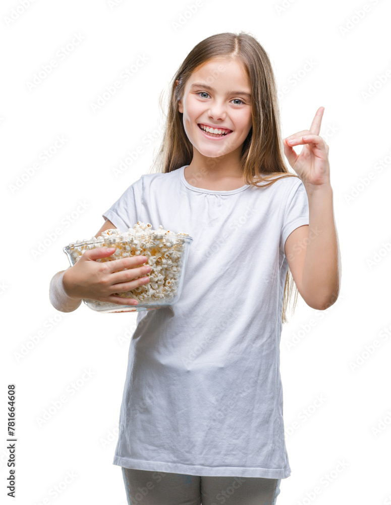 Young beautiful girl eating popcorn snack isolated background surprised with an idea or question pointing finger with happy face, number one Young beautiful girl eating popcorn snack isolated background surprised with an idea or question pointing finger with happy face, number one