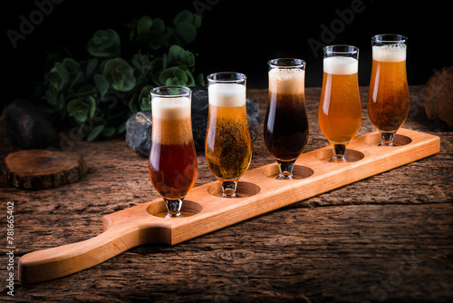 set of 5 beers in glasses for pub, rustic style