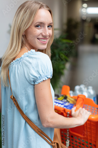 woman shopping for groceries in supermarket