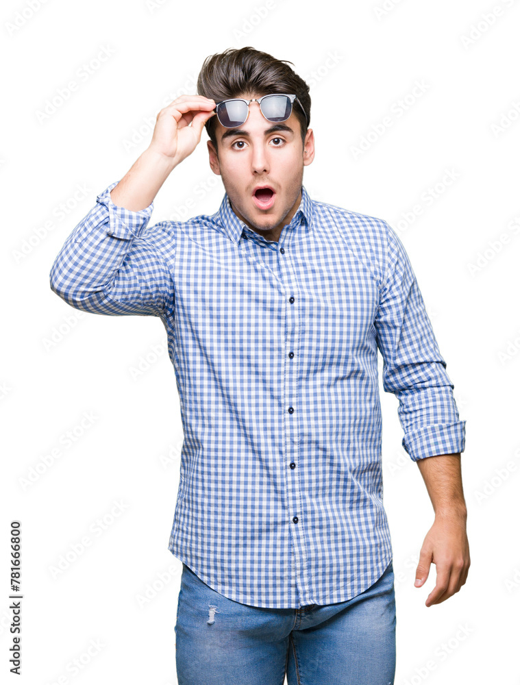 Young handsome man wearing sunglasses over isolated background afraid and shocked with surprise expression, fear and excited face. Young handsome man wearing sunglasses over isolated background afraid and shocked with surprise expression, fear and excited face.