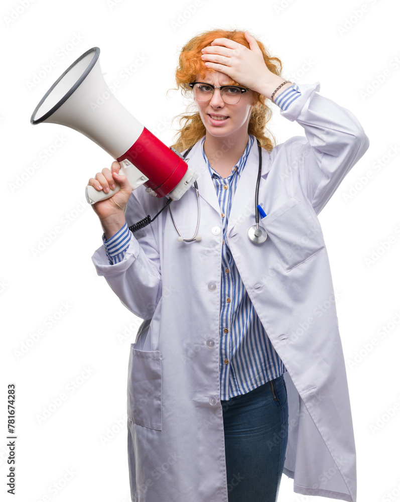 Young redhead doctor woman holding megaphone stressed with hand on head, shocked with shame and surprise face, angry and frustrated. Fear and upset for mistake. Young redhead doctor woman holding megaphone stressed with hand on head, shocked with shame and surprise face, angry and frustrated. Fear and upset for mistake.