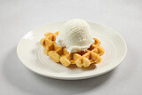 plate of belgian waffle with vanilla ice cream