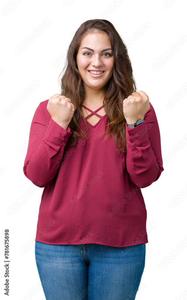 Fototapeta premium Beautiful plus size young woman over isolated background celebrating surprised and amazed for success with arms raised and open eyes. Winner concept.