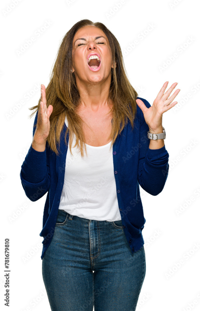 Beautiful middle age casual adult woman over isolated background crazy and mad shouting and yelling with aggressive expression and arms raised. Frustration concept. Beautiful middle age casual adult woman over isolated background crazy and mad shouting and yelling with aggressive expression and arms raised. Frustration concept.