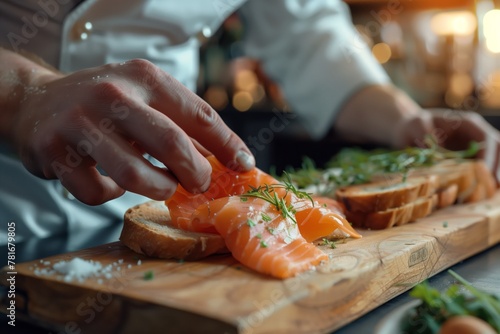 A close-up view of a chef's hands delicately placing thin slices of smoked salmon on cream cheese-slathered crostinis, garnished with dill. 