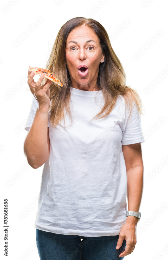 Middle age hispanic woman eating pizza slice over isolated background scared in shock with a surprise face, afraid and excited with fear expression Middle age hispanic woman eating pizza slice over isolated background scared in shock with a surprise face, afraid and excited with fear expression