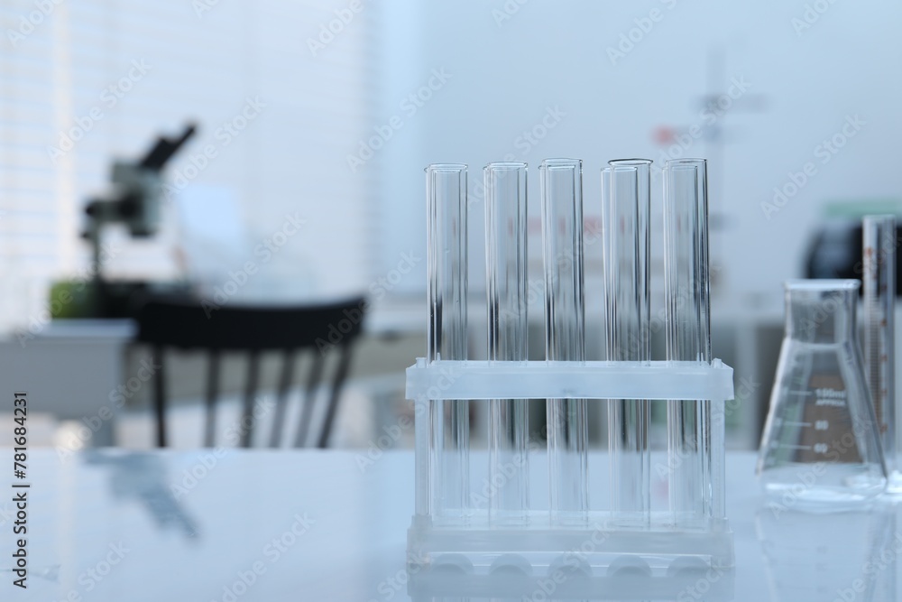 Laboratory analysis. Glass test tubes on white table indoors