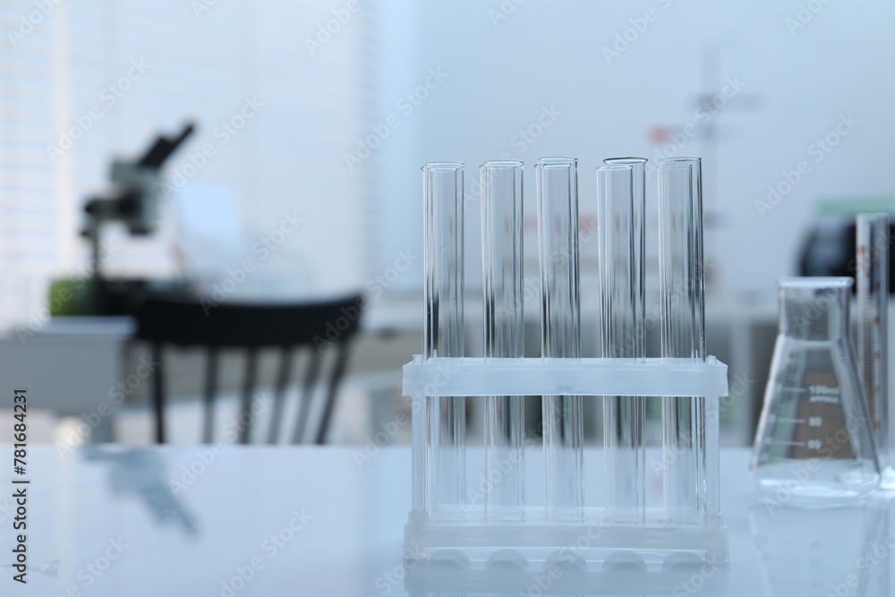 Laboratory analysis. Glass test tubes on white table indoors Laboratory analysis. Glass test tubes on white table indoors